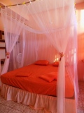 The bed in peach room